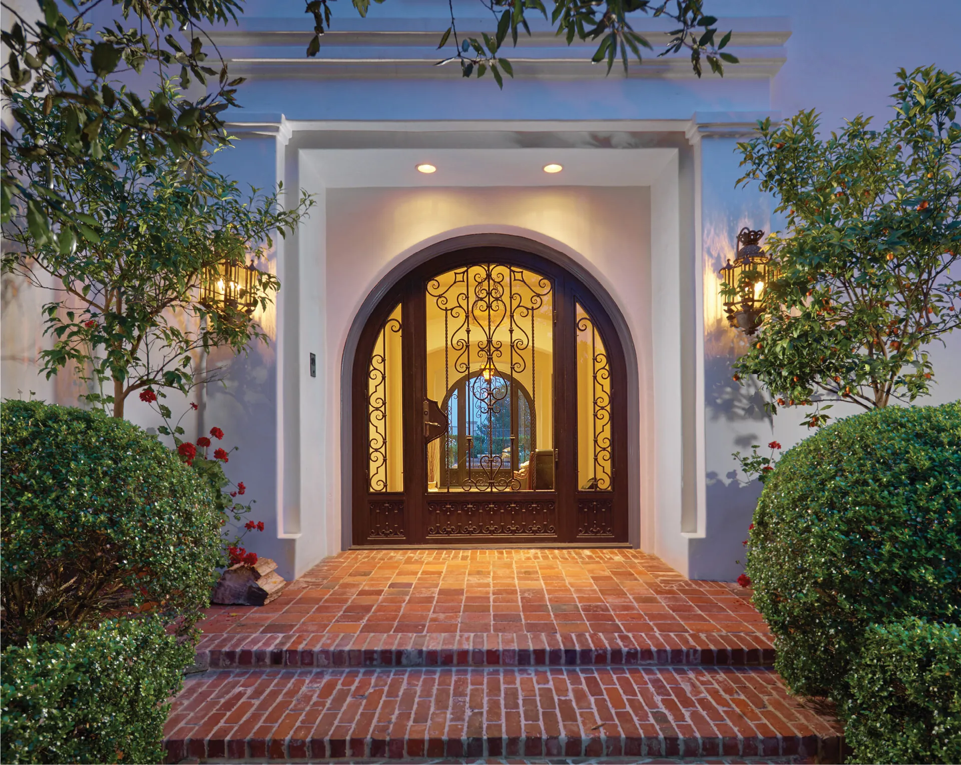 Arched estate entry at twilight